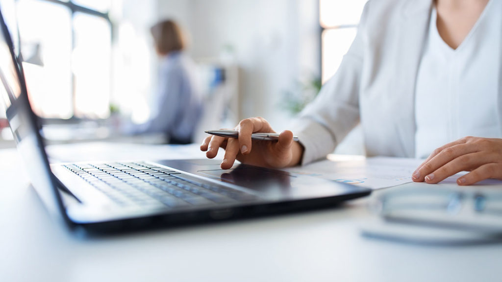 Businesswoman with laptop working at office