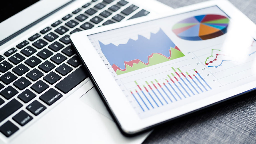 Business charts and diagrams on digital tablet